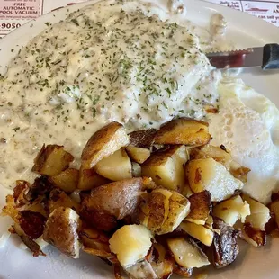 $7.99 daily special: 1 biscuit w/sausage gravy, 1 egg, home fries. Delicious and NOT greasy!!