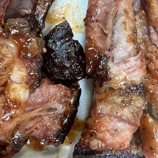 Burnt uncooked meat