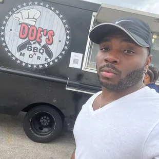 a man standing in front of a food truck