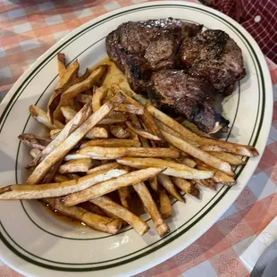 a plate of steak and french fries