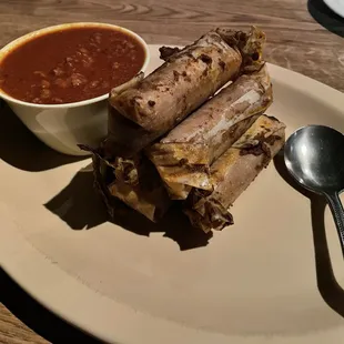 Homemade Tamales with rich, chili sauce