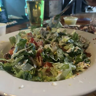 Black and blue salad with steak on the side
