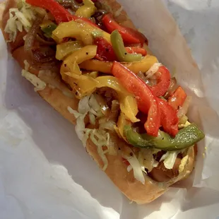 Field Roast veggie dog topped with homemade slaw and grilled peppers. Yum!