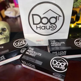 three packages of dog haus