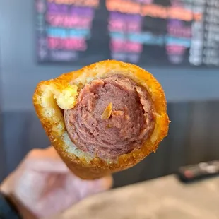 Inside a corn dog. Hot dogs are plump and tasty here.