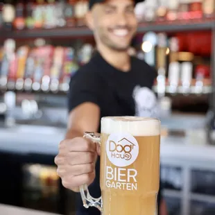 a man holding a beer mug