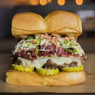 THE MENSCH – white american cheese, pickles, pastrami, haus slaw, secret sauce
