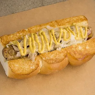 DAS BRAT – bratwurst,  caramelized  onions,  sauerkraut,  spicy brown  mustard