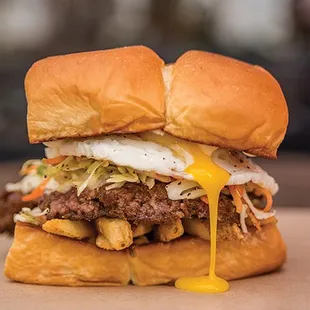 THE FREIBURGER¨ - white american cheese, fries, haus slaw, fried egg, mayo