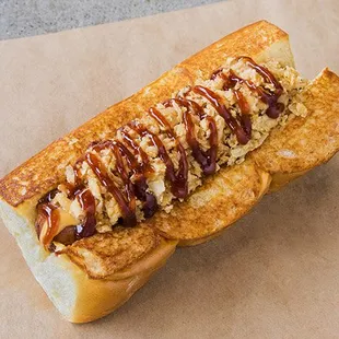 COWBOY - all-beef dog, smoked bacon pieces, cheddar cheese sauce, bbq sauce, crispy onions