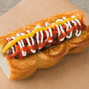 DOWNTOWN – smoked bacon wrapped dog, caramelized onions, pickled peppers, mayo, mustard, ketchup