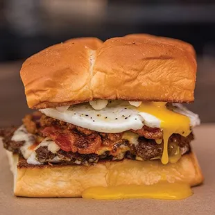 THE HANGOVER- white american cheese,smoked bacon,haus chili,fried egg,mayo