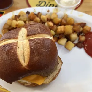 sausage egg and. cheese on pretzel bun
