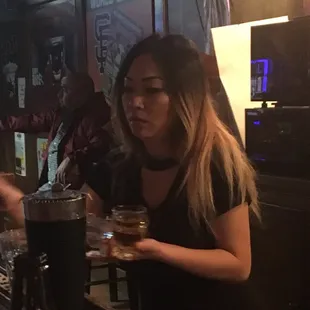 a woman sitting at a bar