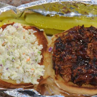 Pulled pork sandwich, pickle spears &amp; homemade slaw!