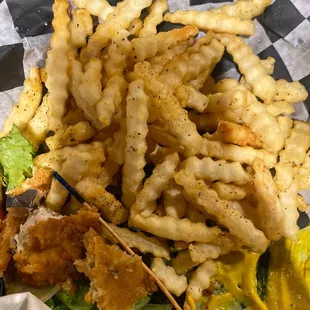 All the stuff on the fries is from an unclean fryer. Tastes of burnt onion rings and fryer muck.