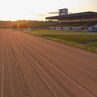 a horse racing track at sunset