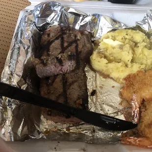 My order. Strip steak mash potatoes and butterfly shrimp