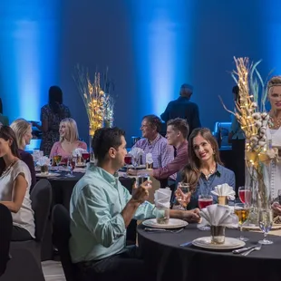 a group of people sitting around a table