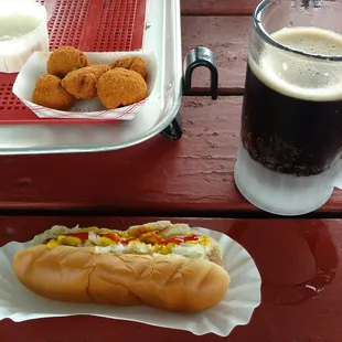 Closest is the hotdog, root beer, and fried mushrooms.  Further my friends double bacon cheese burger (in the wrapper)