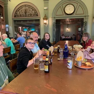 a group of people sitting at a table