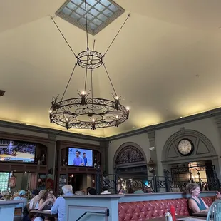 people sitting at tables and eating