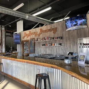 a bar with a large screen tv