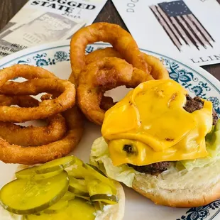 a hamburger and onion rings