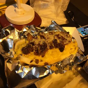 a hot dog wrapped in foil