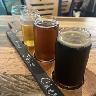 Beer flight.  4 beers of choice includes souvenir glass.