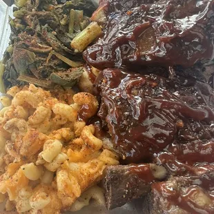 Beef ribs, Mac n cheese, greens, extra seasoning and bbq sauce