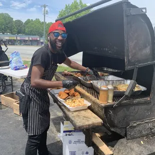 One of the many amazing guys cooking this food for everyone.