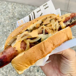 TJ style jumbo dog with grilled onions and chipotle crema sauce - perfection on a bun