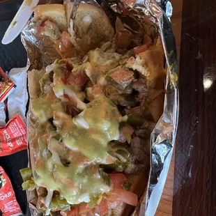 a hot dog in a foil wrap