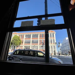 a view of a street through a window