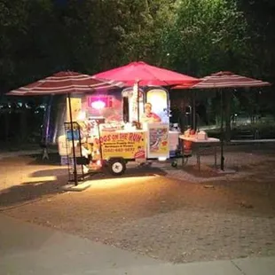 a hot dog stand at night