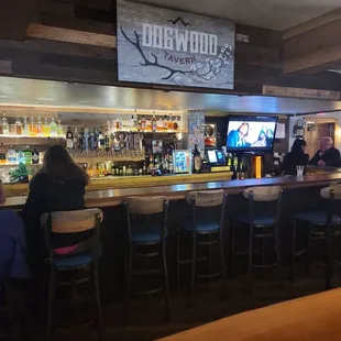 people sitting at the bar