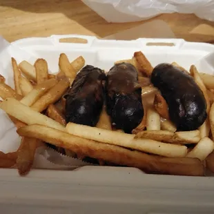 Bangers &amp; Chips: Irish Sausages topped with a Savory Brown Gravy, served over Hot and Crispy Fries