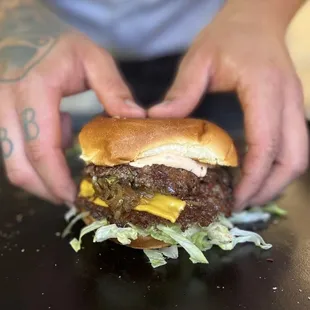 a man holding a hamburger