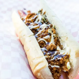 WUSHU DOG Pork sung and flash-grilled cabbage drizzled with a sweet and savory katsu sauce, topped with Japanese mayo