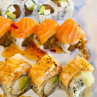 a plate of sushi rolls