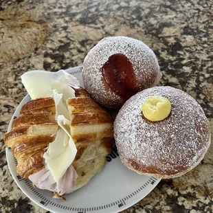 Ham and Mozzarella Croissant and 2 Ciambella one cream and one strawberry.