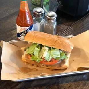 a sandwich with lettuce, tomato, and lettuce