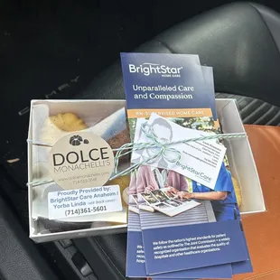 Sampler packet with company brochures and card pushed under ribbon.
