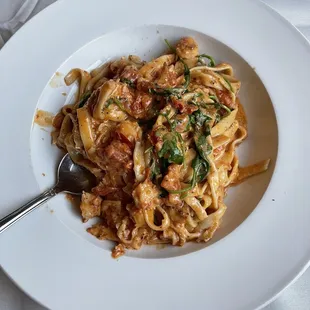 Homemade pasta with lobster in red sauce