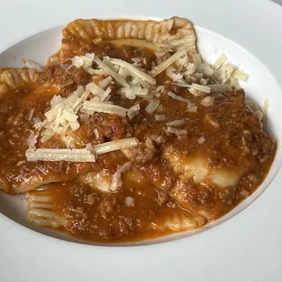 Homemade ravioli in bolognese