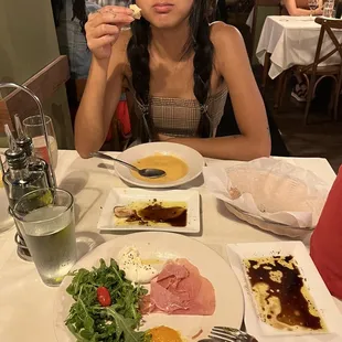 Partially eaten Prosciutto and Burrata and lobster bisque! The phone did not get to eat first.