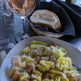 Caesar half salad $6, glass of white zinfandel $7