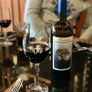 a glass of wine and a bottle of wine