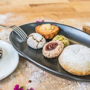 a plate of donuts and pastries